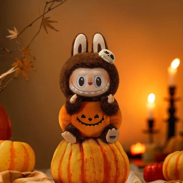 Front view of the POP MART Labubu Sitting Pumpkin plush pendant